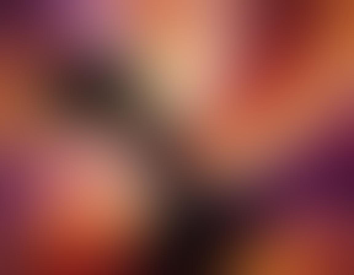 A vibrant and abstract representation of pleasure and intimacy, featuring lush, flowing shapes intertwined with soft, glowing lights. Central to the image, a silhouette of a person enveloped in swirling colors, evoking a sense of ecstasy and exploration. The background should radiate warmth and intrigue, with a balance of deep reds, purples, and golds. The overall composition should convey a sense of liberation and joyful curiosity. Abstract art. vibrant colors. soft glow.